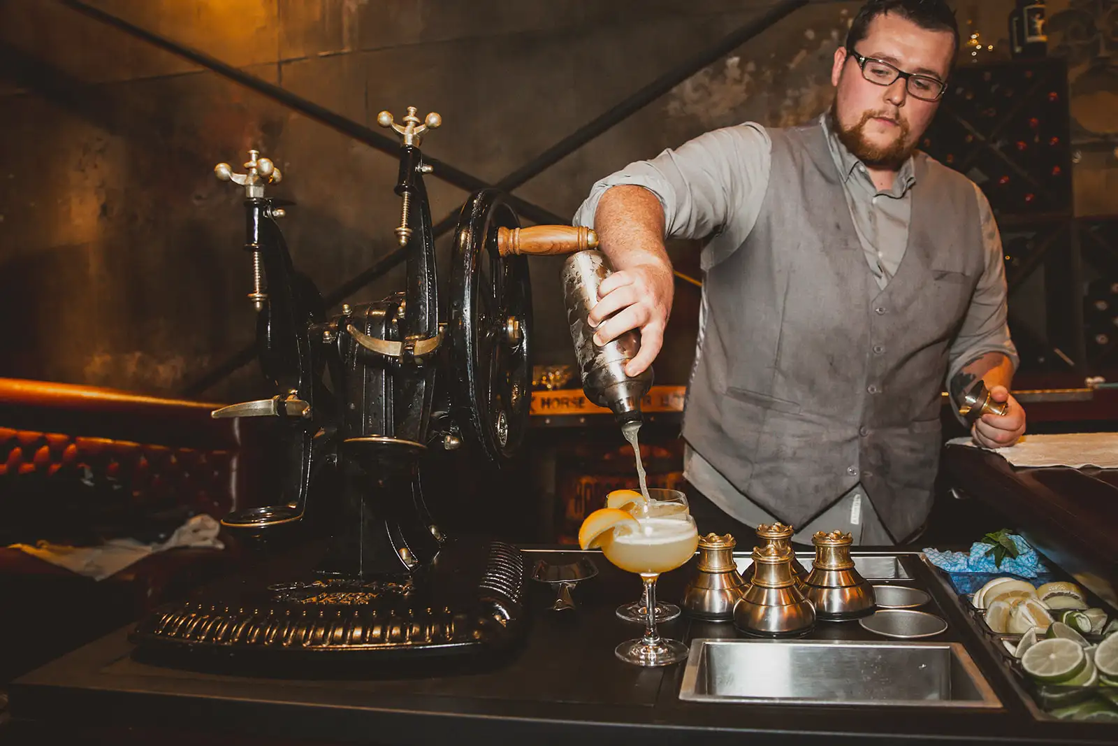 Bartender pouring a cocktail at a corporate holiday party