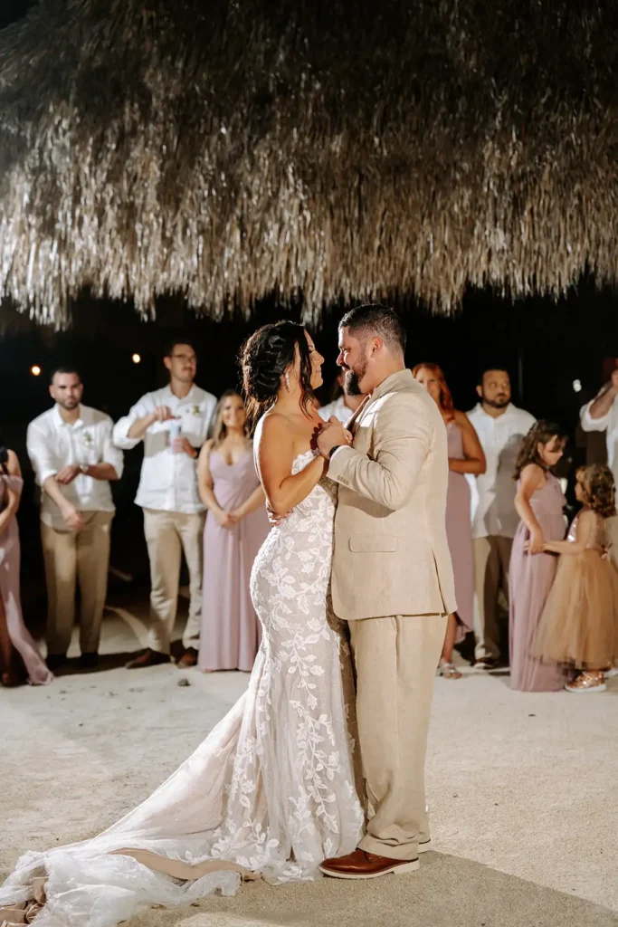 bride and groom dance nder tiki hut South Florida
