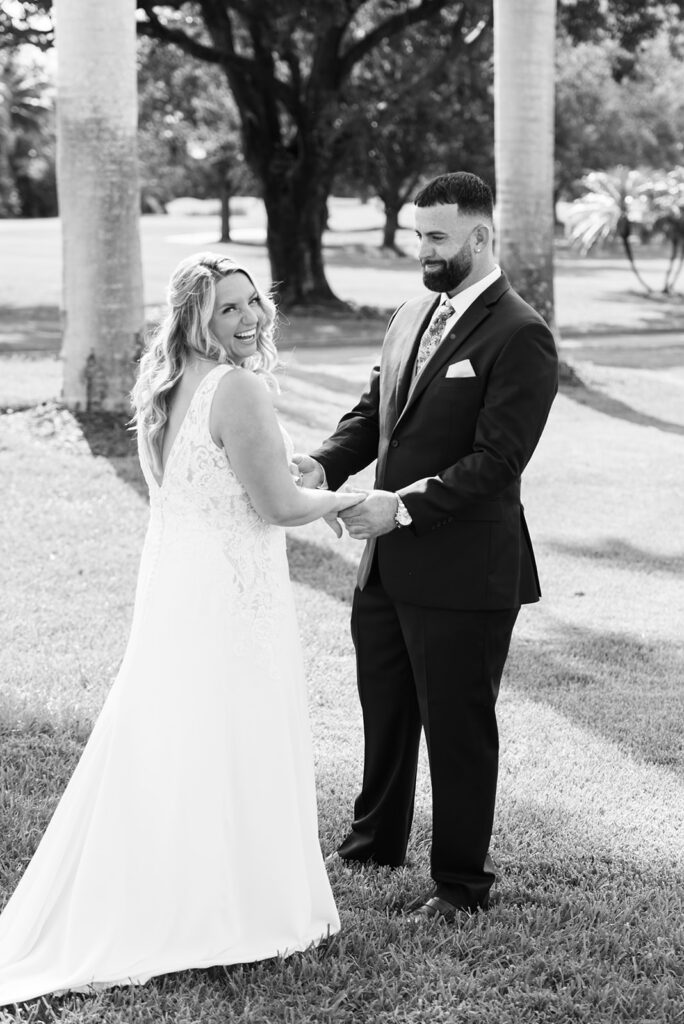 black and white photo of bride and groom outside