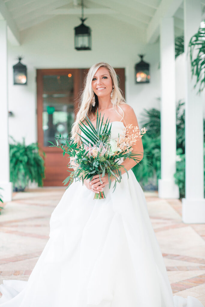 bride and large bouquet in walkway