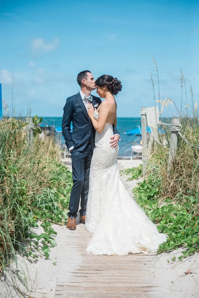 bride and groom on sandy paty to beach