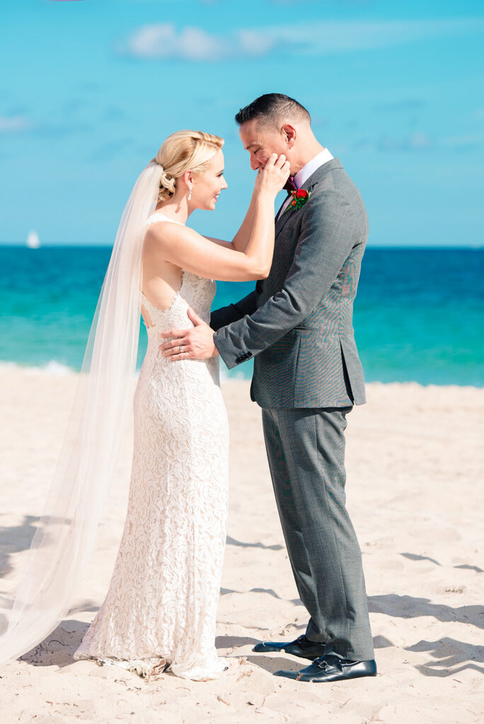 bride and groom first look on beach