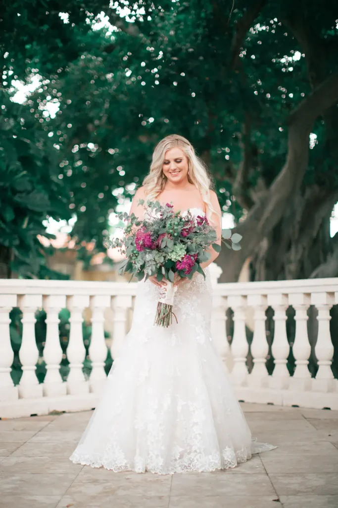 Bride and large bouquet outside South Florida wedding venue