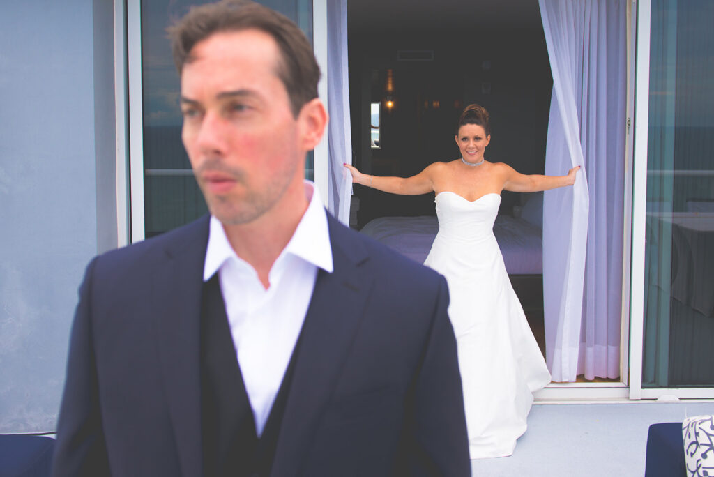 bride sneaking up on groom for first look