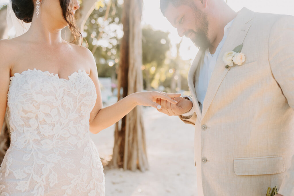 groom admiring brides ring