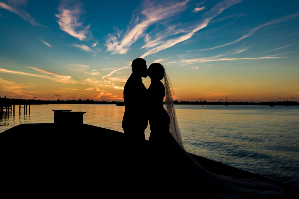 sunset photo of bride and groom by Cona Studios Florida