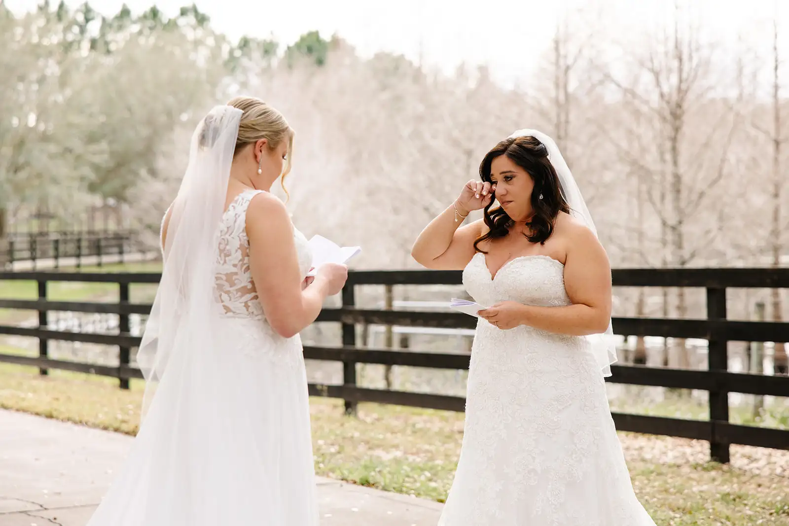 Two brides crying during first look