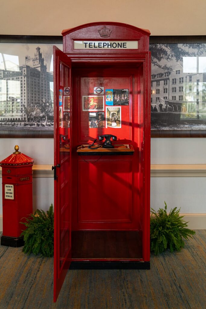 red photobooth prop resembling a antique phone booth