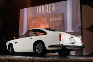 white antique car representing Austin Powers themed event
