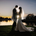 backlit silhouette of bride and groom photographed by Cona Studios