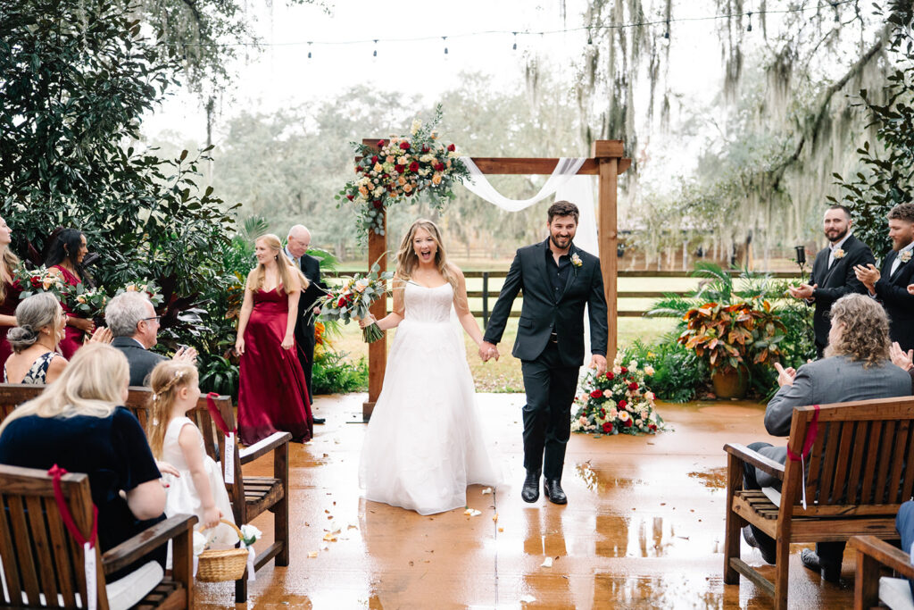 Bride and groom walking down the aisle at a Central Florida wedding ceremony
