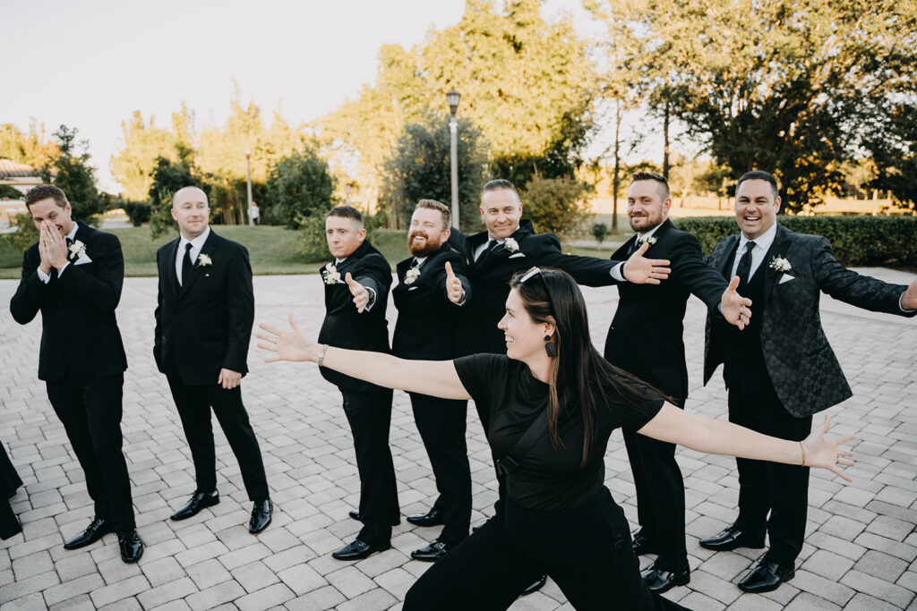 Cona Studios photographers help groomsmen pose for photos