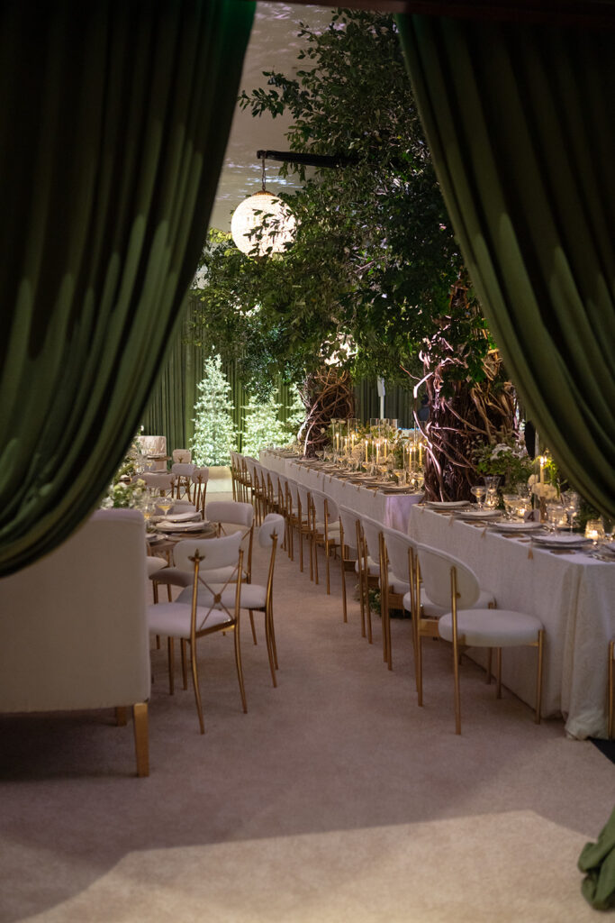 Luxurious green draping creates a grand entrance at a Bella Collina wedding