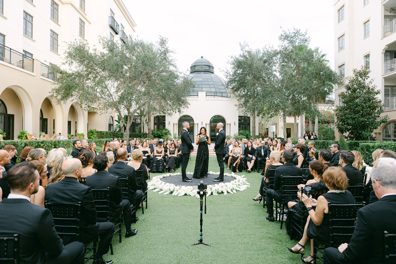Wedding ceremony in the round with guests in all black