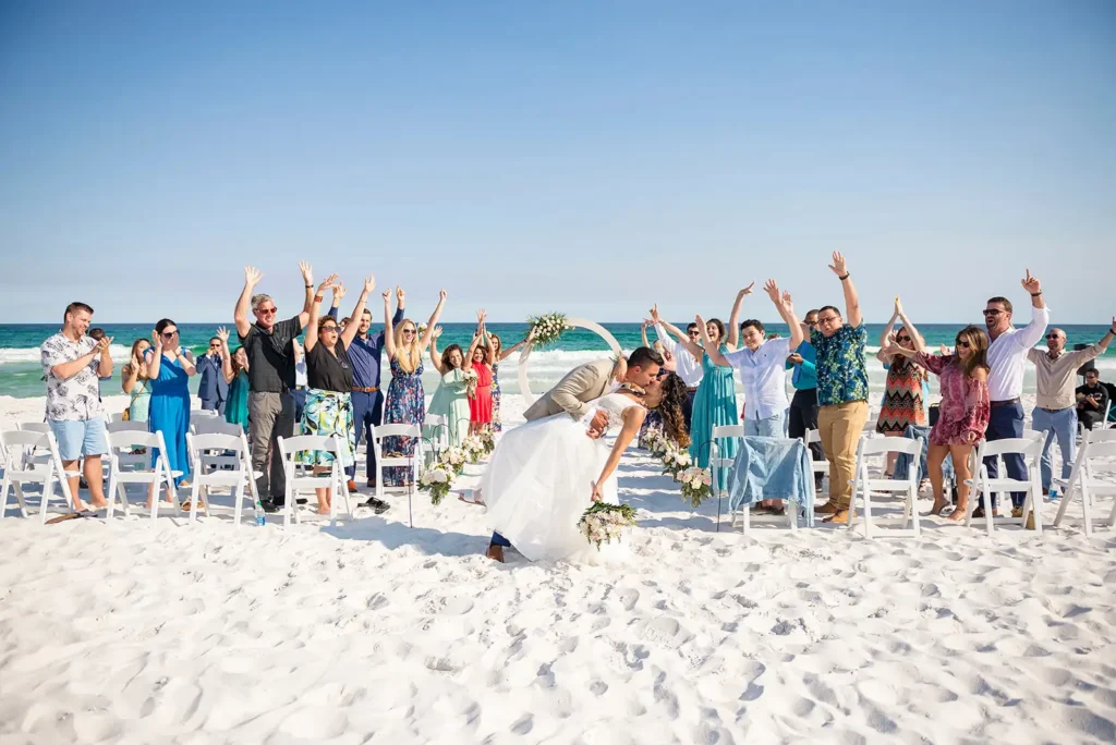 Groom dips bride at South Florida beach wedding ceremony