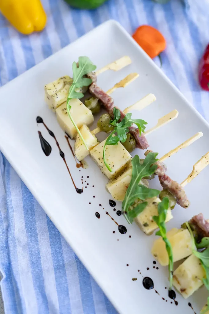 Small bite size appetizers on white plate
