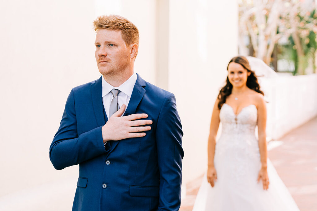 groom waiting for bride during first look