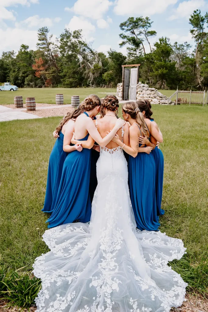bride and bridesmaid group hug