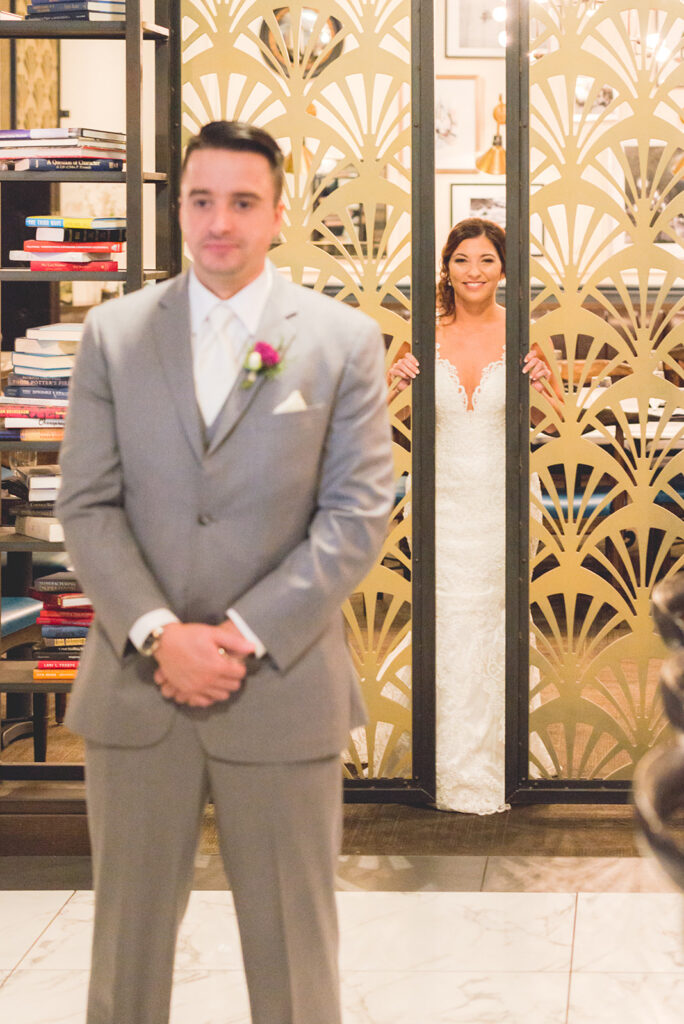 bride enters gates to see groom