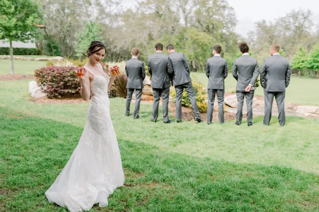 Bride first look with fireball and groomsmen