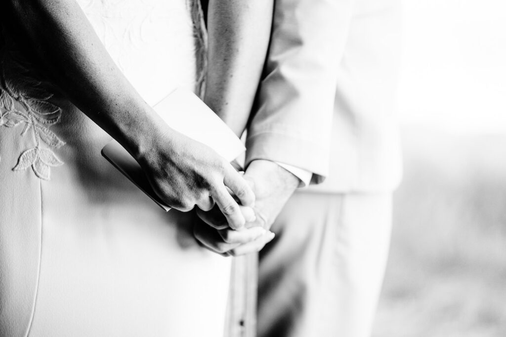 bride and groom holding hands