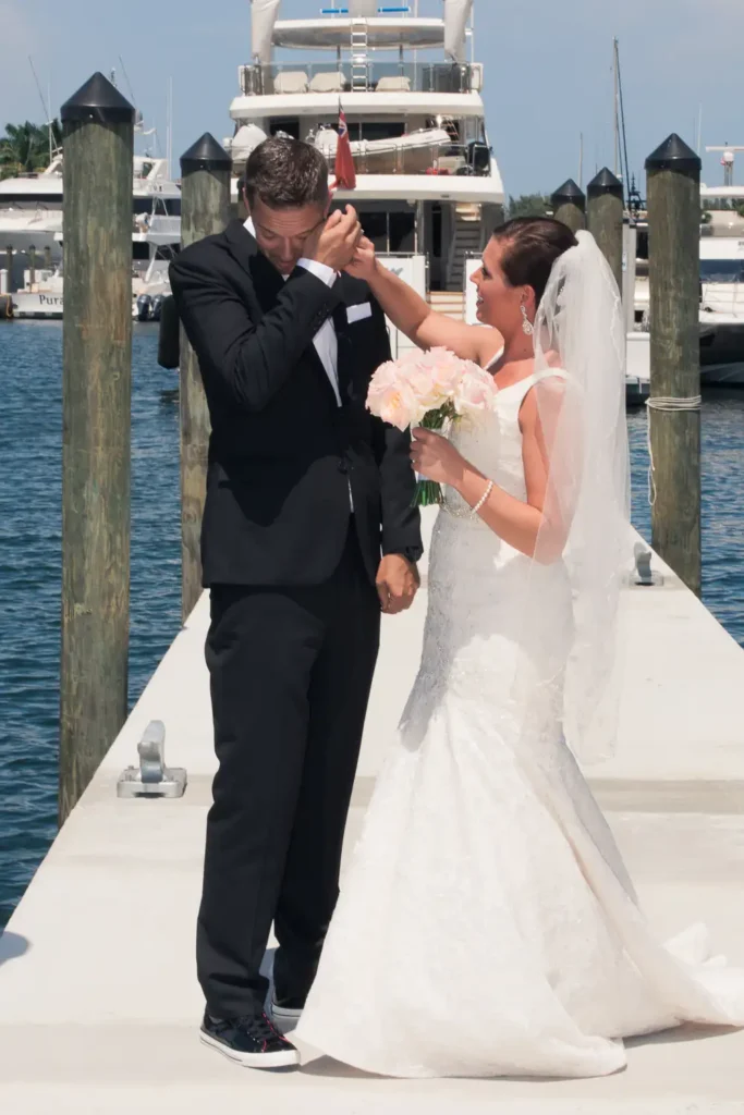 bride wipes groom's eyes