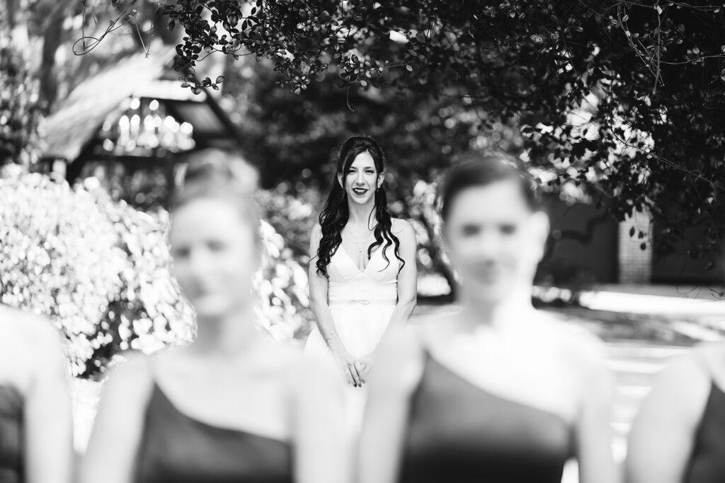 black and white bride bridesmaids first look