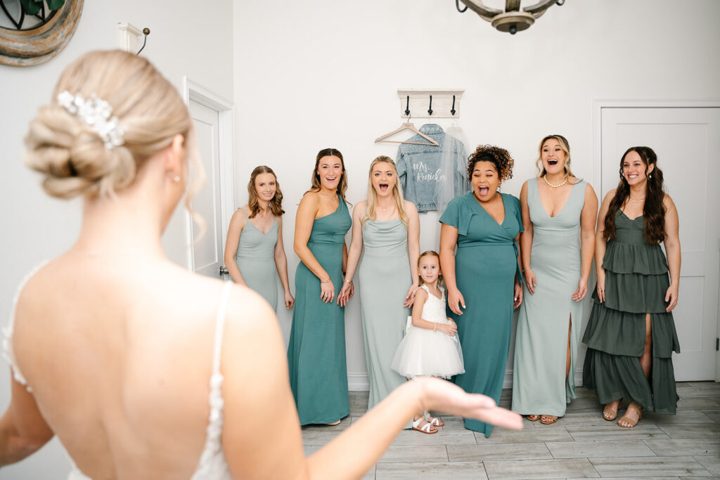 bride and bridesmaids first look