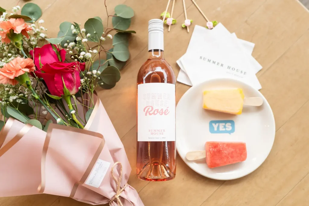 Rose and popsicles on table with flowers