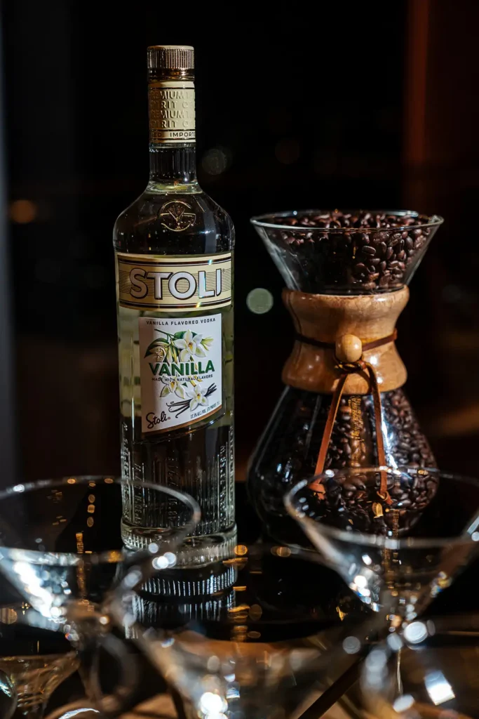 Close up of cocktail glasees, coffee beans and liquor