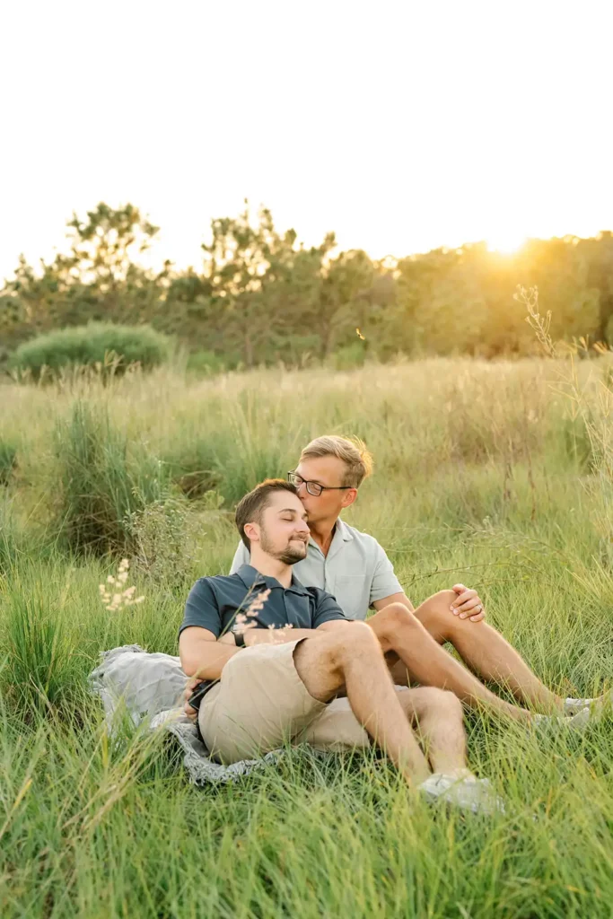 Couple embraces in field in Florida