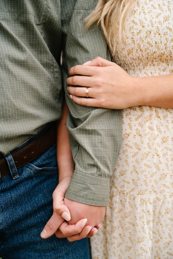 Hands clasped in engagement photo shoot