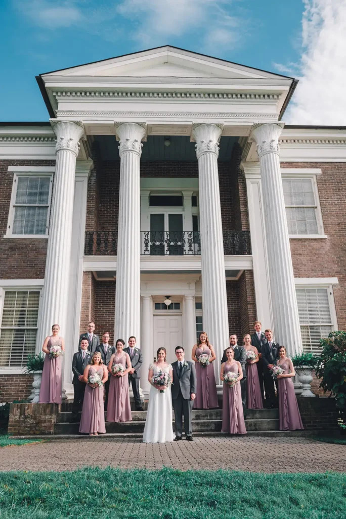Bridal party on steps of wedding venue