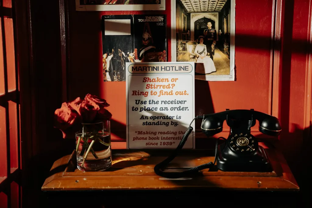 Detail shot of inside of vintage red photo booth as part of corporate event decor