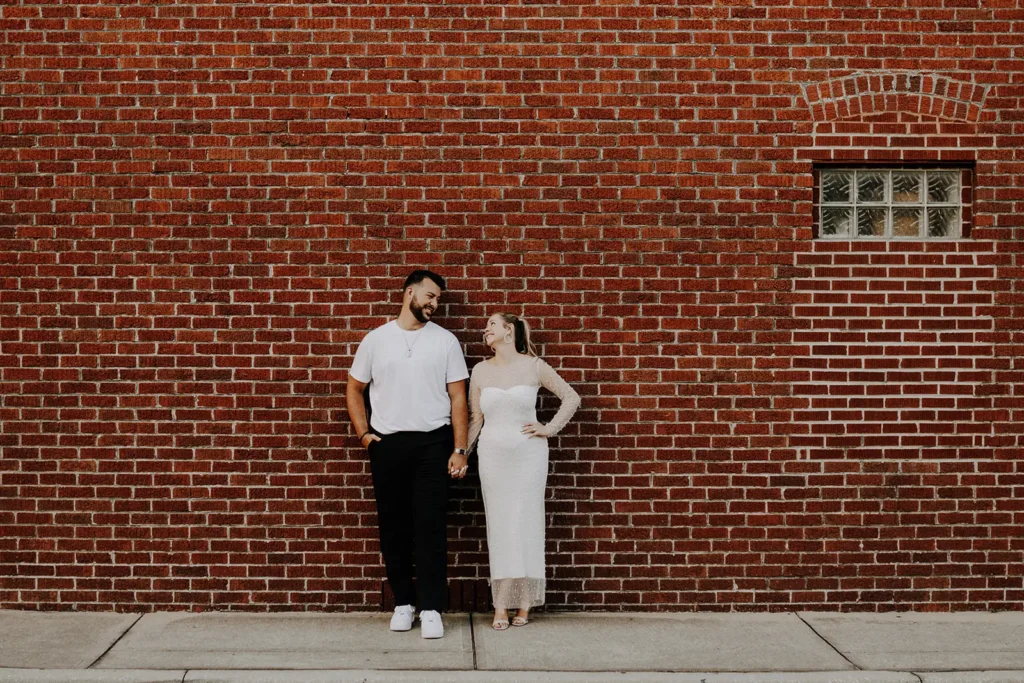 Engagement photo brick wall