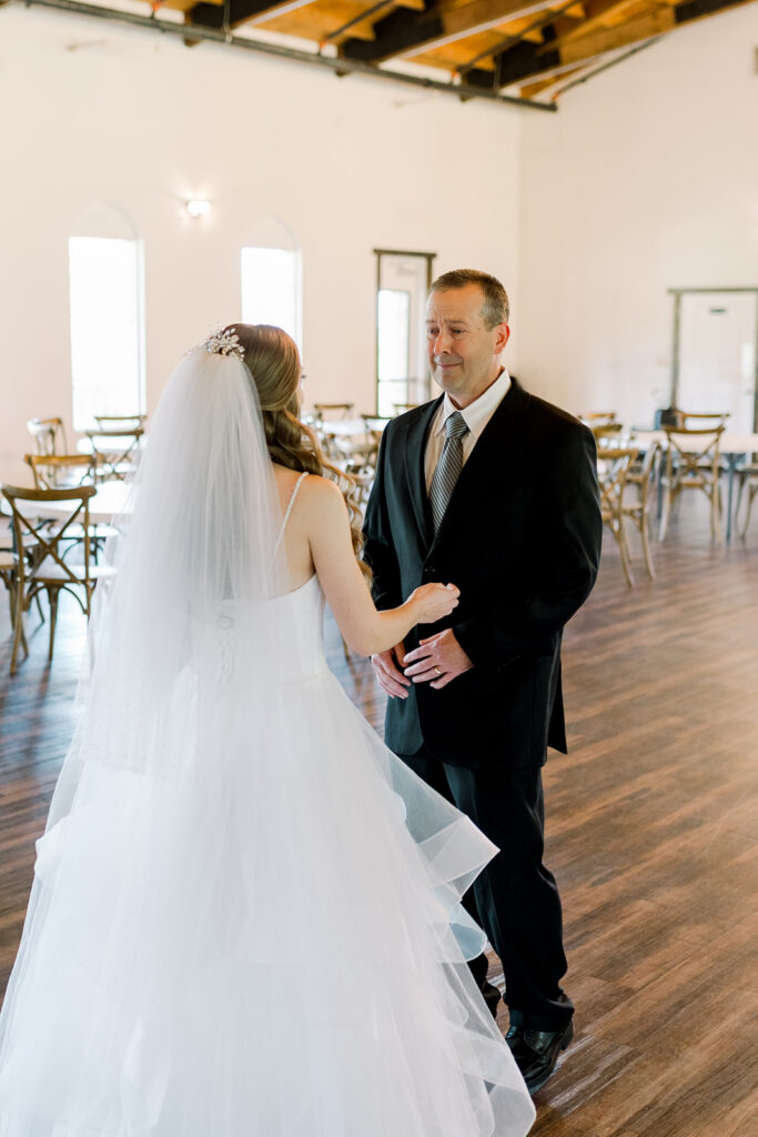 father crying when he sees daughter in wedding dress