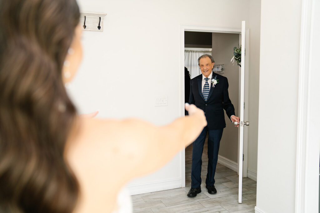 dad enters room to see daughter in wedding dress