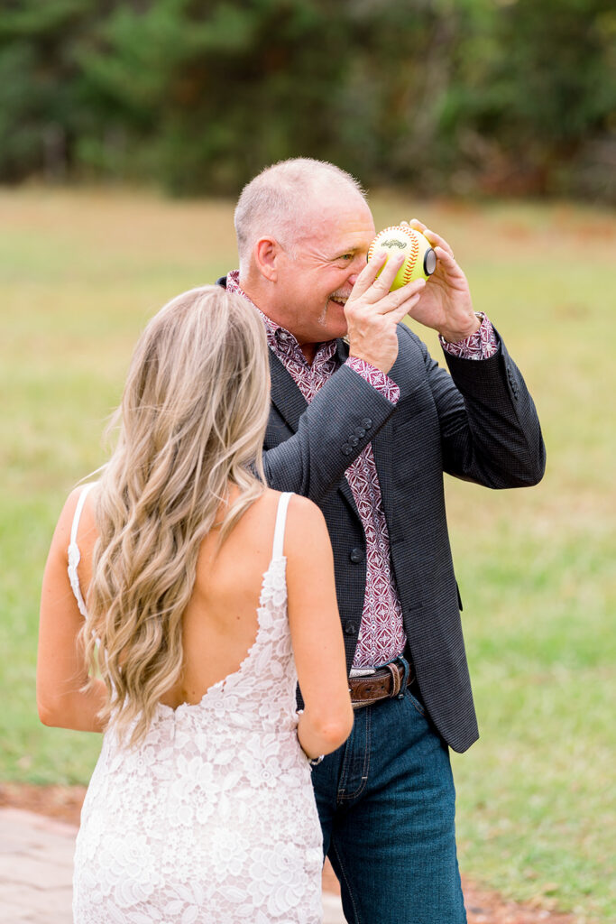 dad enjoying wedding day gift from daughter