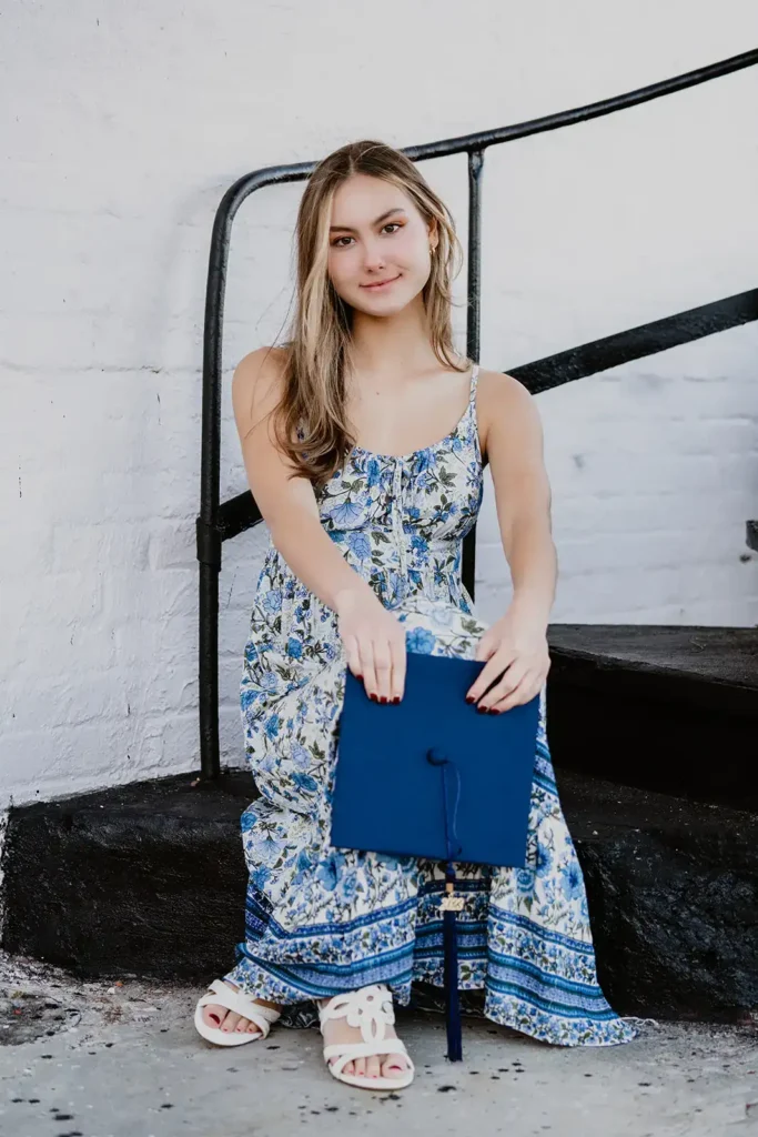 Girl with grad cap for photo shoot on stairwell