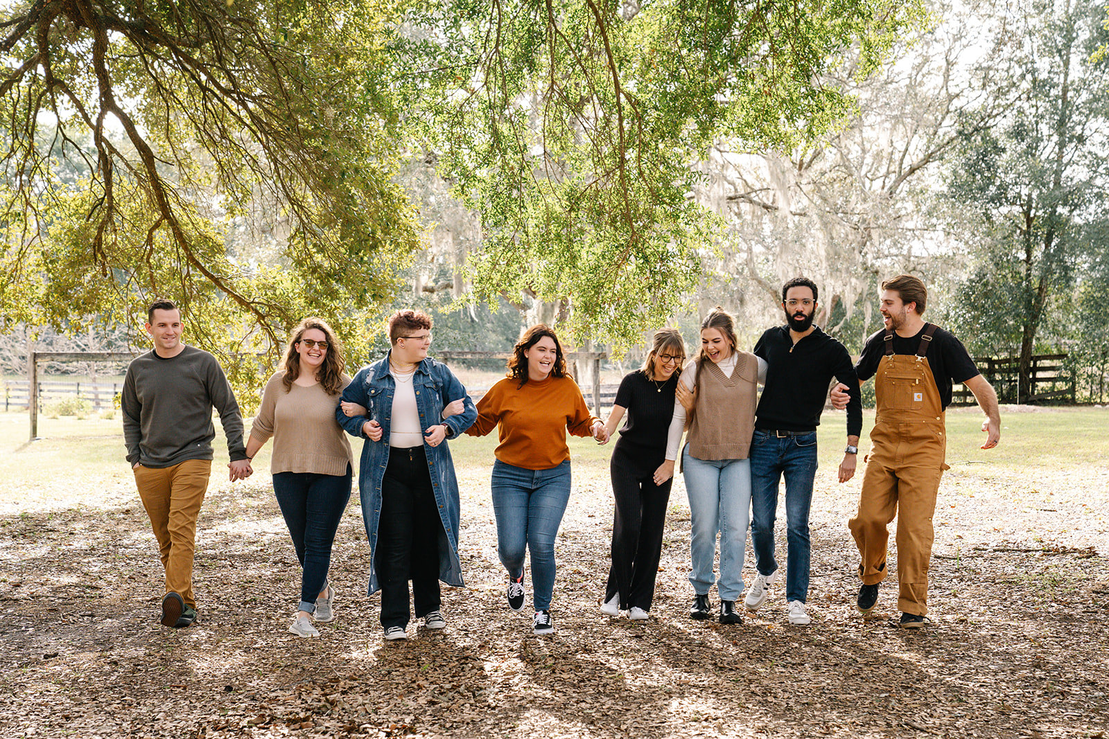 Grandchildren running arm in arm for family photos