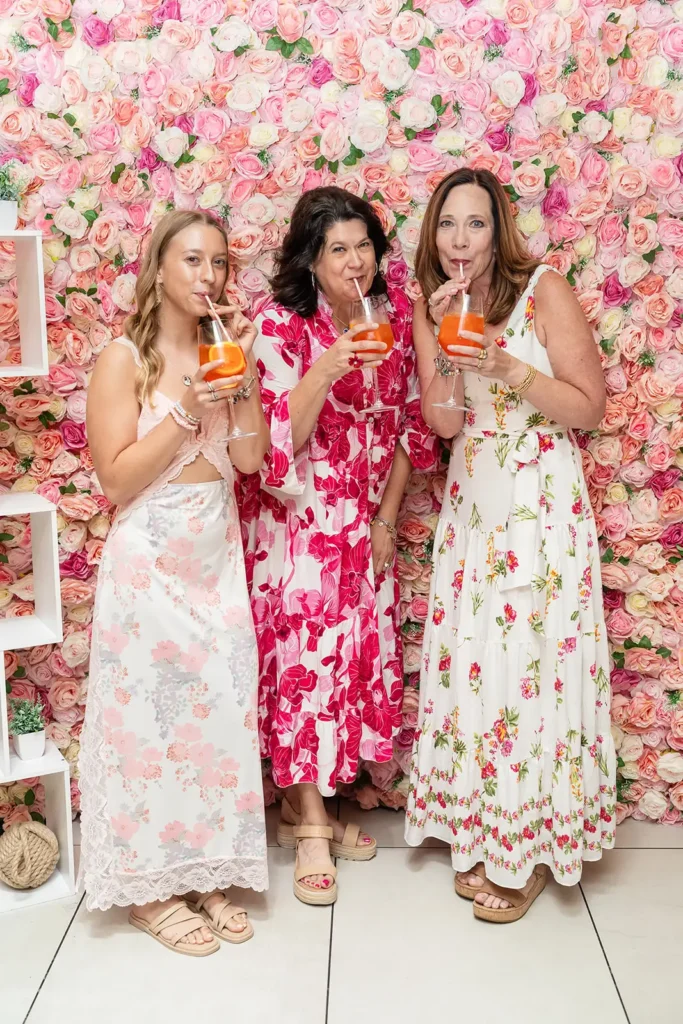 Three women sipiping on Rose spritzers