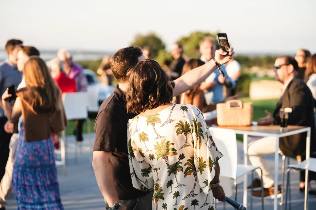 Guests taking a selfie at The Bridge IX event
