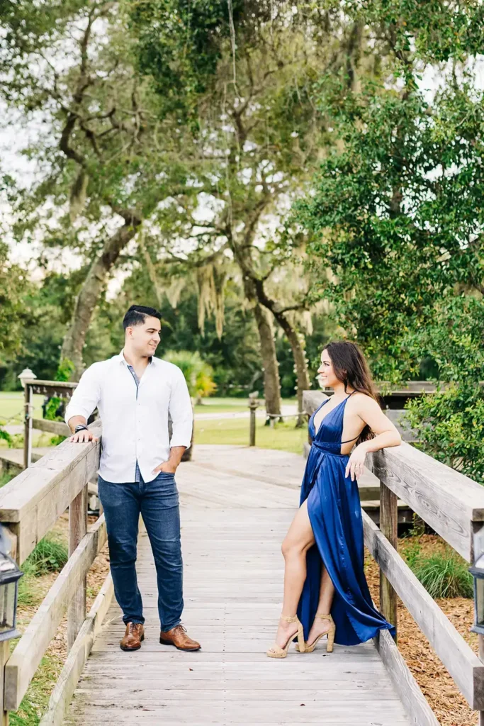 Man and woman on boardwalk for engagement shoot