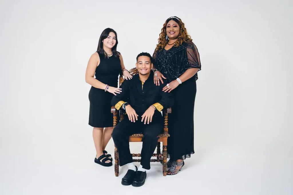 Family photo of mom, daughter and son with all white background