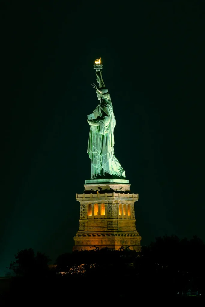 Statue of Liberty at night photographed by Cona Studios Florida