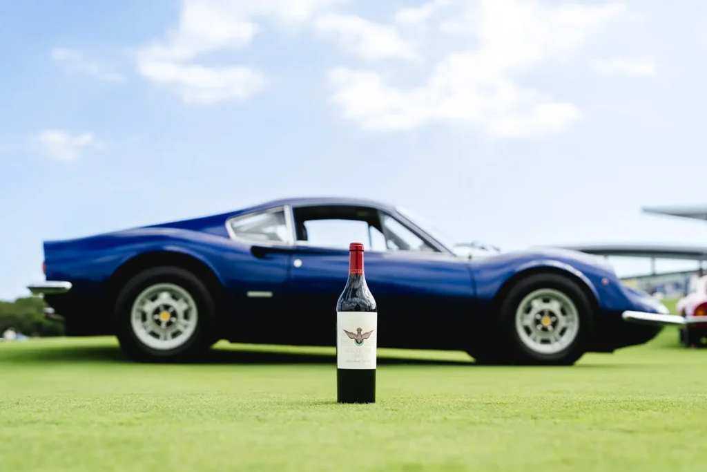 Vintage sports car and a bottle of wine at The Bridge IX