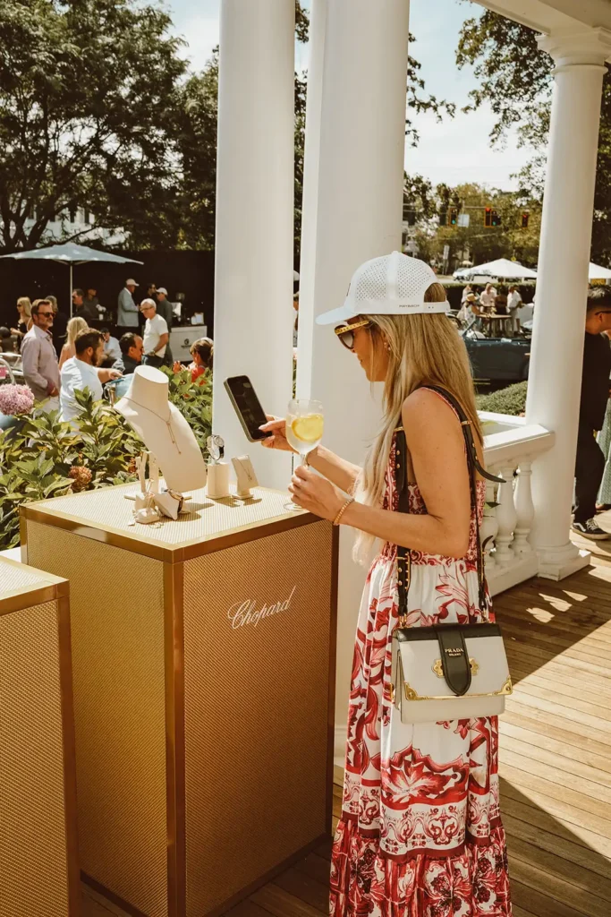Woman taking photo of jewelry at a brand activation