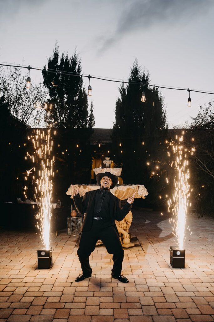 Groom celebrating with two sparkler fountains